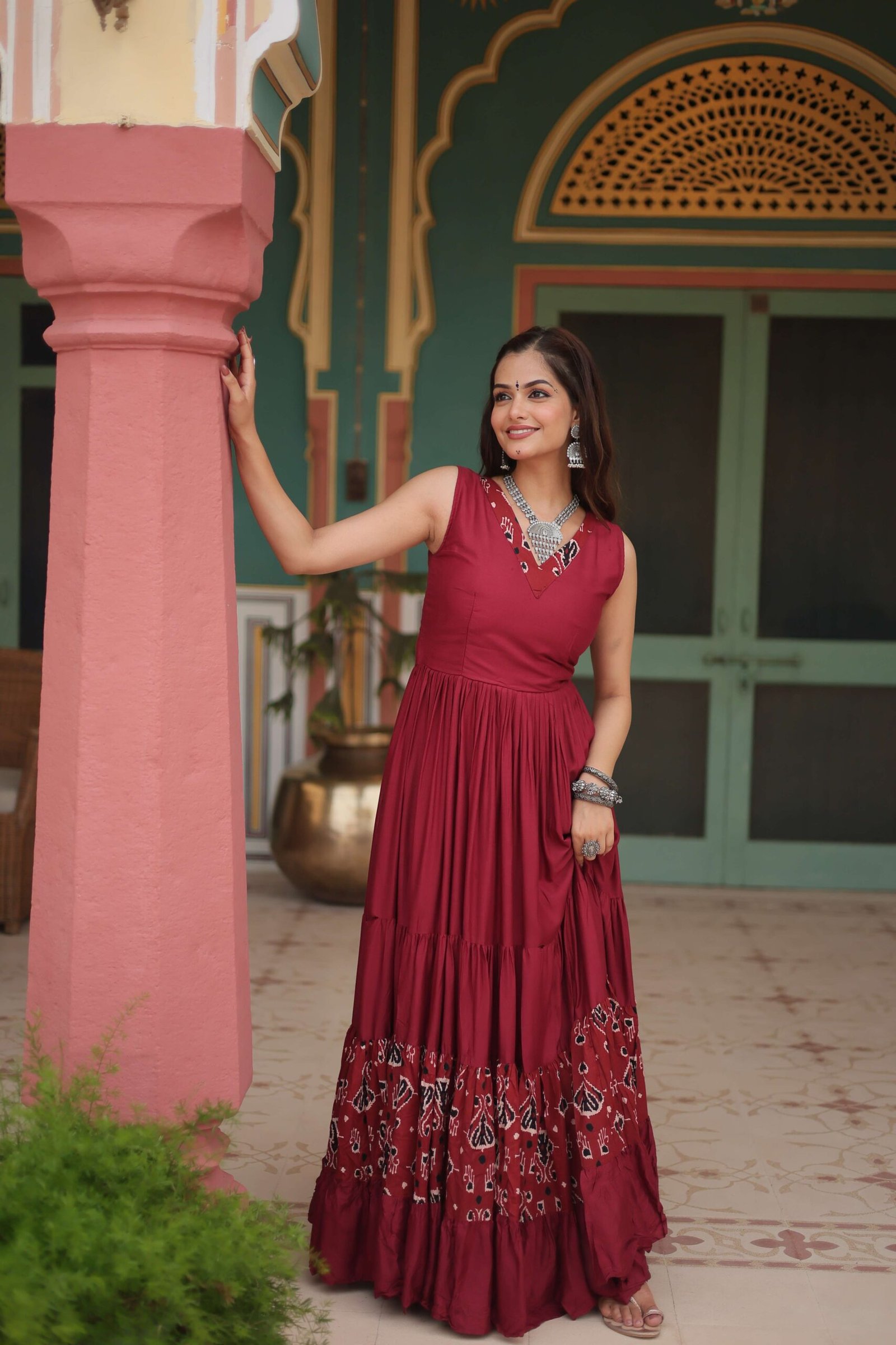 Maroon Designer Heavy Reyon Gown with Printed Frill & Fancy V-Neck - Image 4